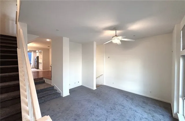 a view of a hallway with a bathroom