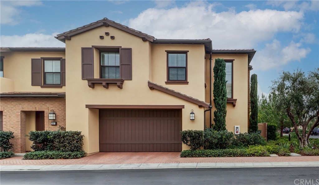 259 Rodeo Irvine, CA 92602 - Photo 1 of 1 a front view of a house with a yard and garage