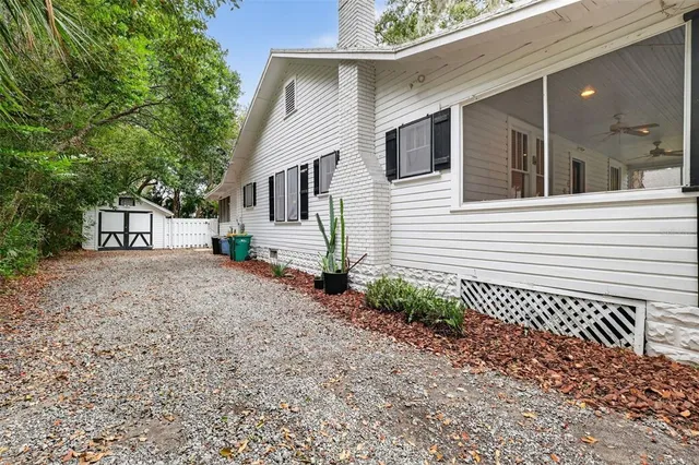 a view of a house with a backyard