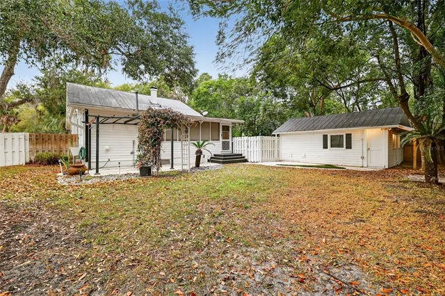 a backyard of a house with yard and garage