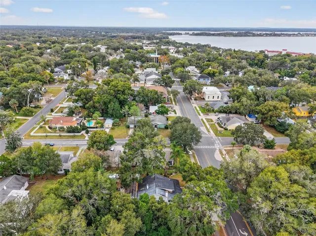 an aerial view of residential house with outdoor space and swimming pool