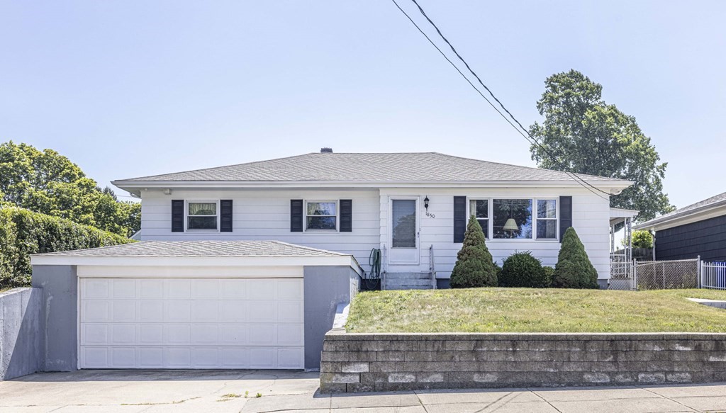1850 Rodman Street Fall River, MA 02721 - Photo 1 of 42 a front view of a house with garden