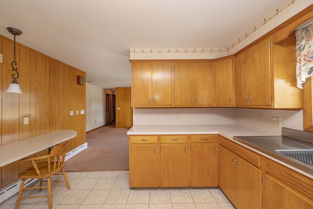 1850 Rodman Street Fall River, MA 02721 - Photo 13 of 42 a kitchen with a sink and cabinets