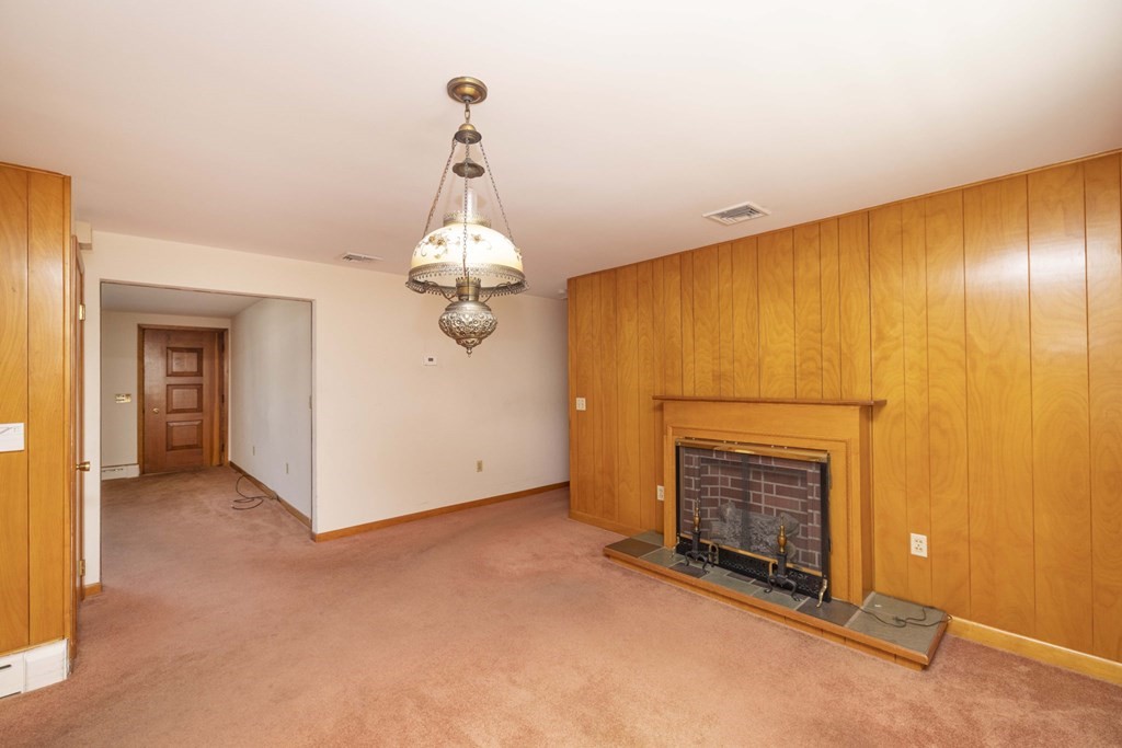 1850 Rodman Street Fall River, MA 02721 - Photo 21 of 42 a view of empty room with fireplace