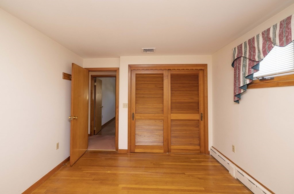 1850 Rodman Street Fall River, MA 02721 - Photo 25 of 42 a view of a hallway with wooden floor and closet