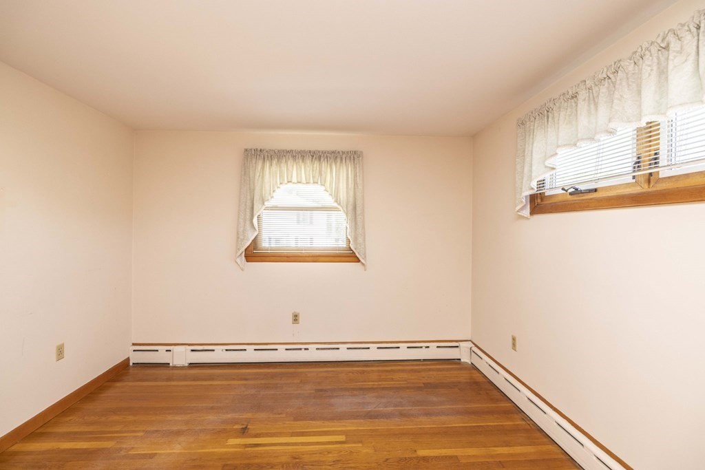 1850 Rodman Street Fall River, MA 02721 - Photo 29 of 42 a view of a room with wooden floor and windows