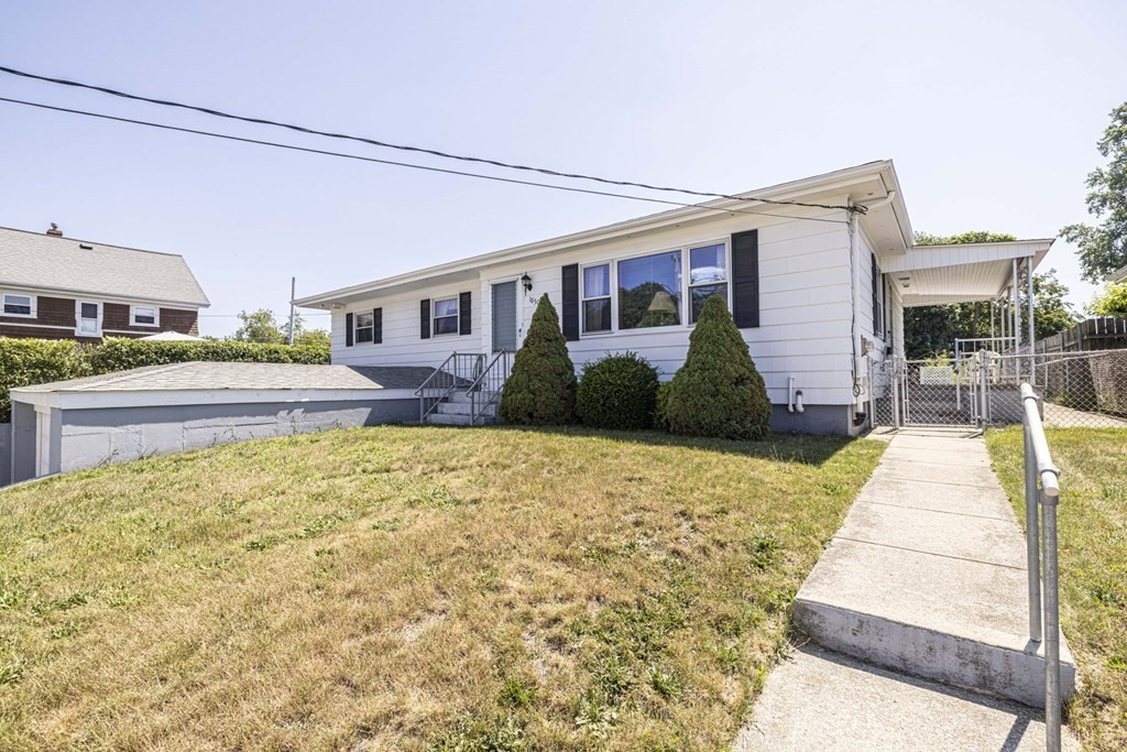 1850 Rodman Street Fall River, MA 02721 - Photo 3 of 42 a front view of a house with a yard