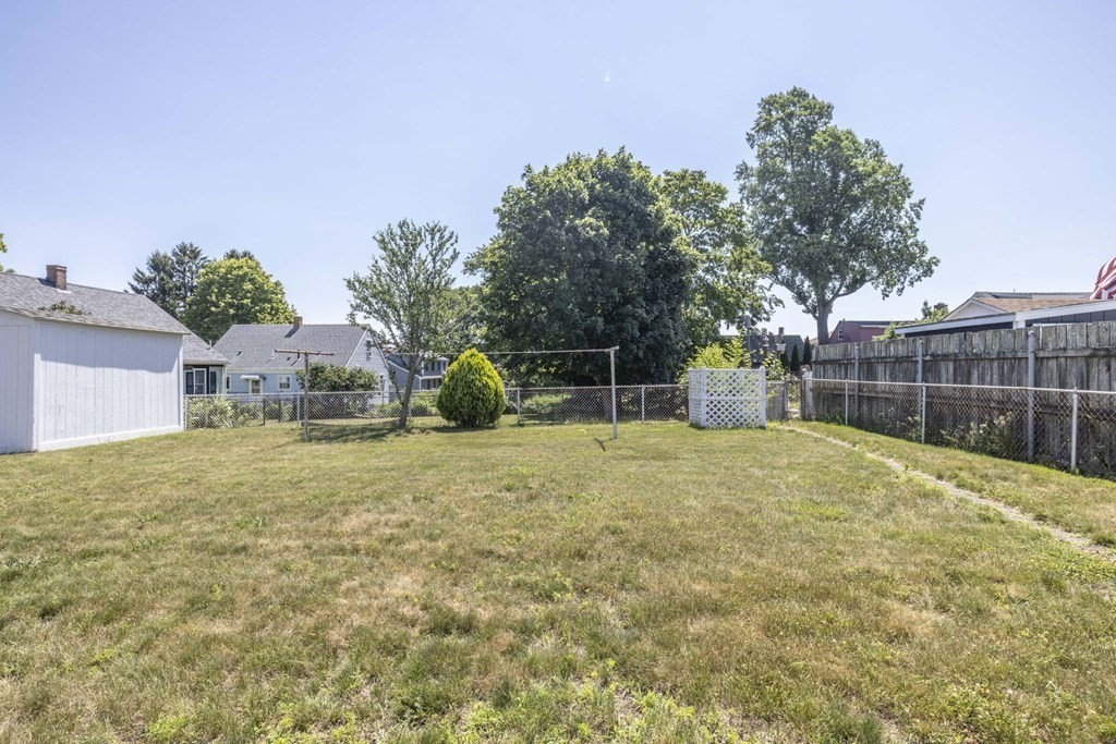 1850 Rodman Street Fall River, MA 02721 - Photo 7 of 42 a house with trees in front of it