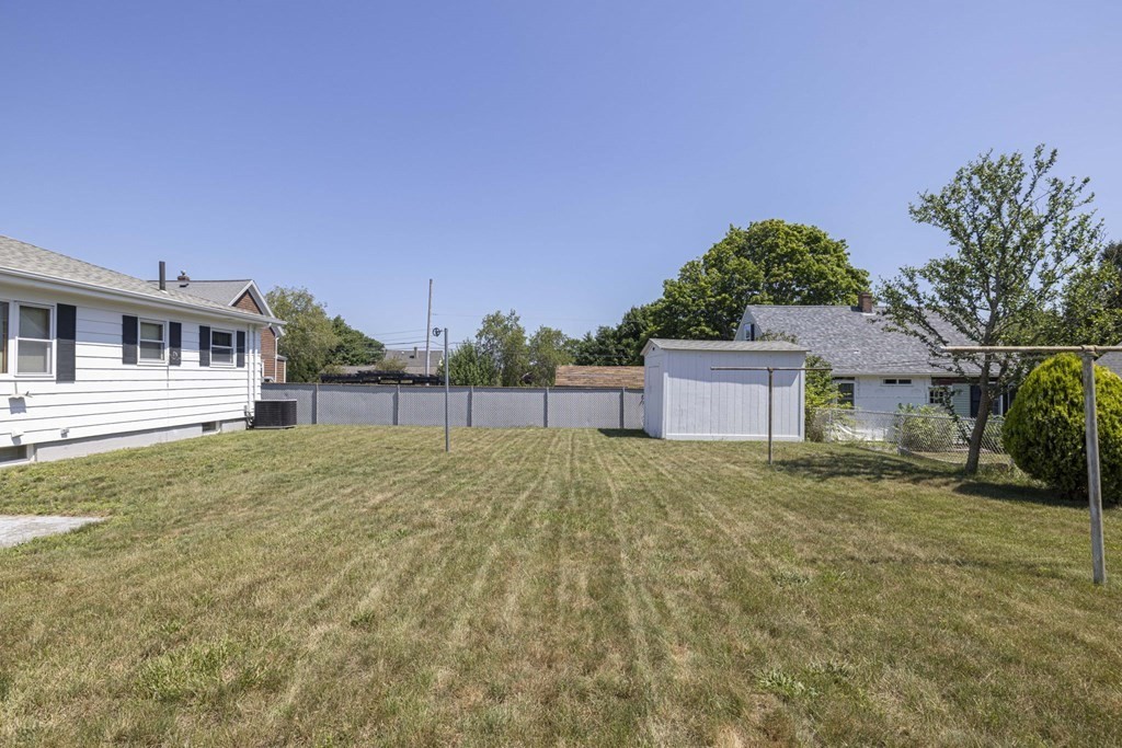 1850 Rodman Street Fall River, MA 02721 - Photo 8 of 42 front view of a house with a yard