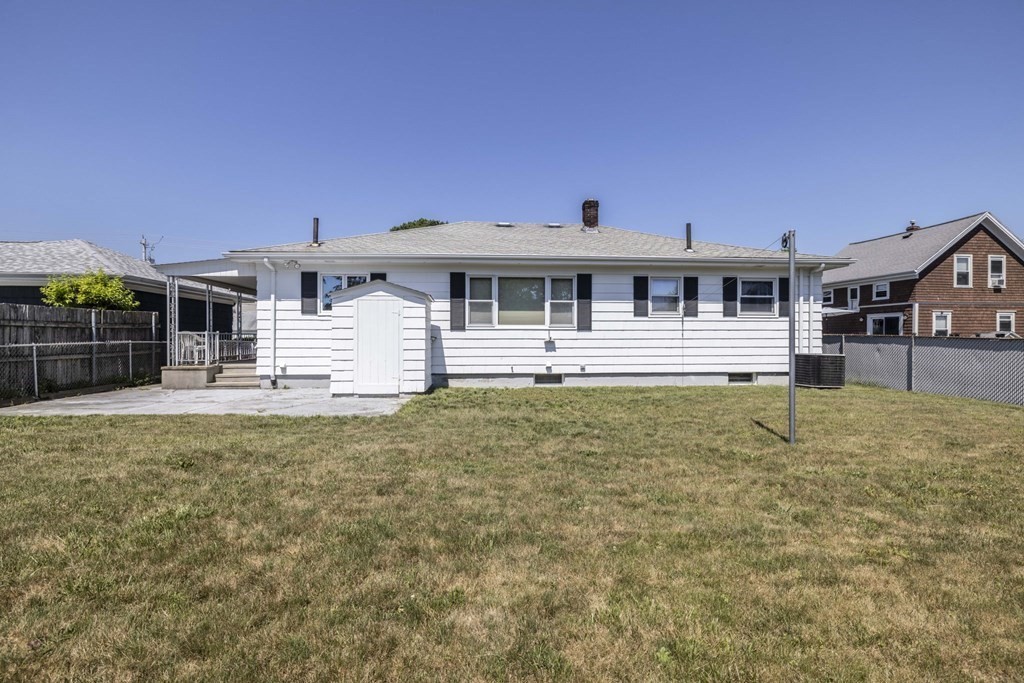 1850 Rodman Street Fall River, MA 02721 - Photo 10 of 42 a front view of a house with a yard