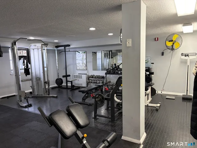 a view of a livingroom with furniture and a gym