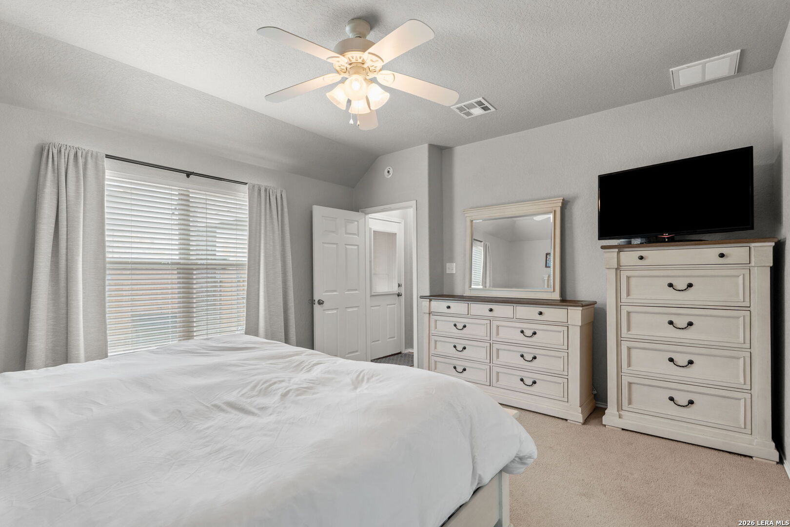3041 Turquoise Schertz, TX 78154 - Photo 15 of 19 a bedroom with a bed a flat screen tv and a dresser
