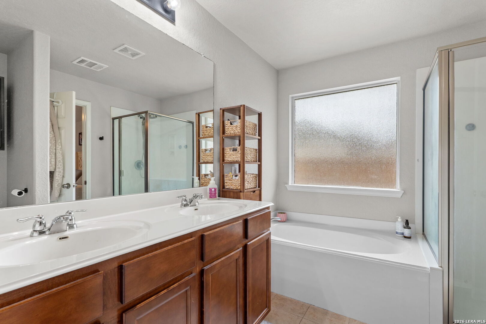 3041 Turquoise Schertz, TX 78154 - Photo 16 of 19 a bathroom with a granite countertop sink mirror bathtub and double
