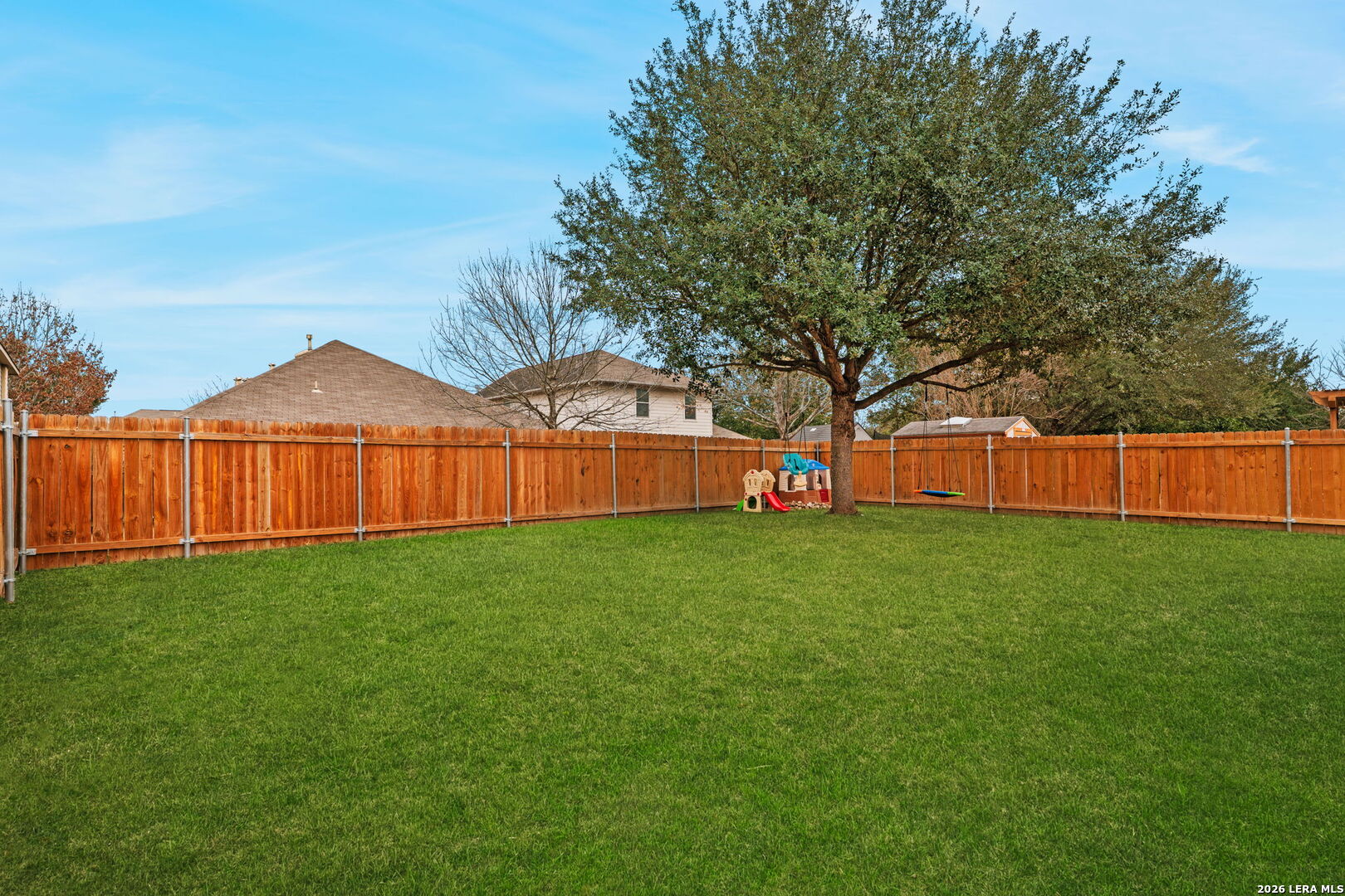 3041 Turquoise Schertz, TX 78154 - Photo 19 of 19 a view of a backyard with a garden and deck