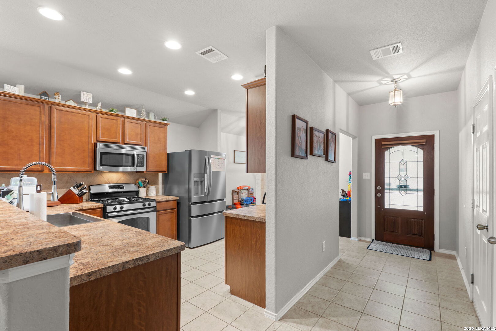 3041 Turquoise Schertz, TX 78154 - Photo 6 of 19 a kitchen with stainless steel appliances granite countertop a refrigerator stove and oven