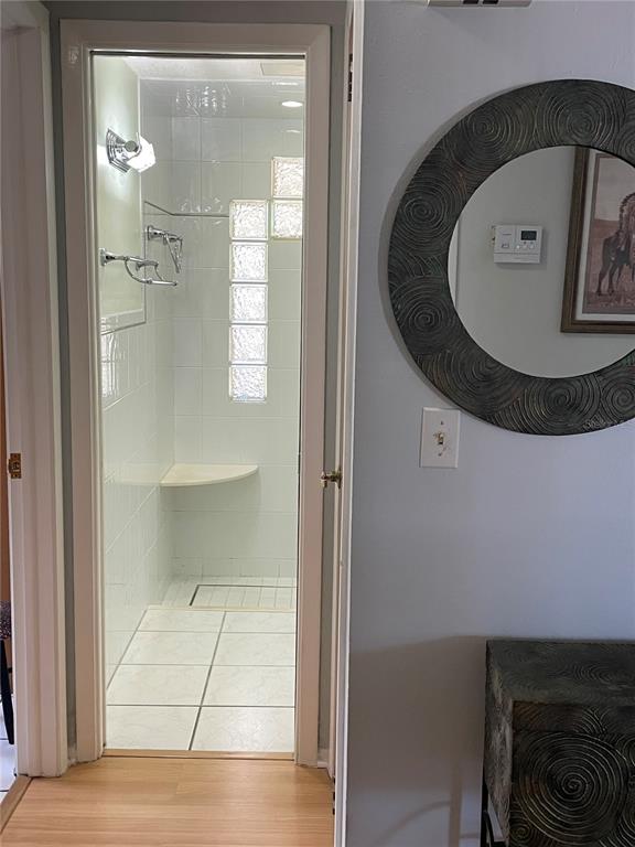 6944 Larchmont Avenue New Port Richey, FL 34653 - Photo 12 of 28 a view of a livingroom with wooden floor and a staircase