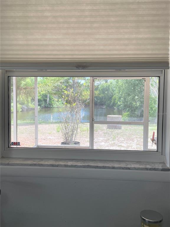 6944 Larchmont Avenue New Port Richey, FL 34653 - Photo 15 of 28 a view of a room that has a window