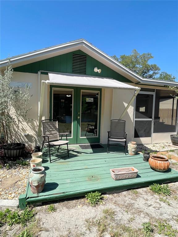 6944 Larchmont Avenue New Port Richey, FL 34653 - Photo 20 of 28 a front view of a house with garden