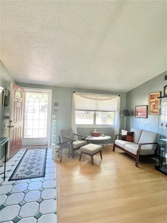 6944 Larchmont Avenue New Port Richey, FL 34653 - Photo 2 of 28 a living room with furniture and a window