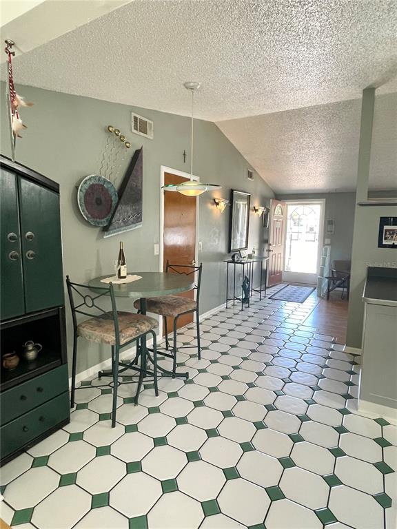 6944 Larchmont Avenue New Port Richey, FL 34653 - Photo 5 of 28 a kitchen with granite countertop a stove a sink and a refrigerator