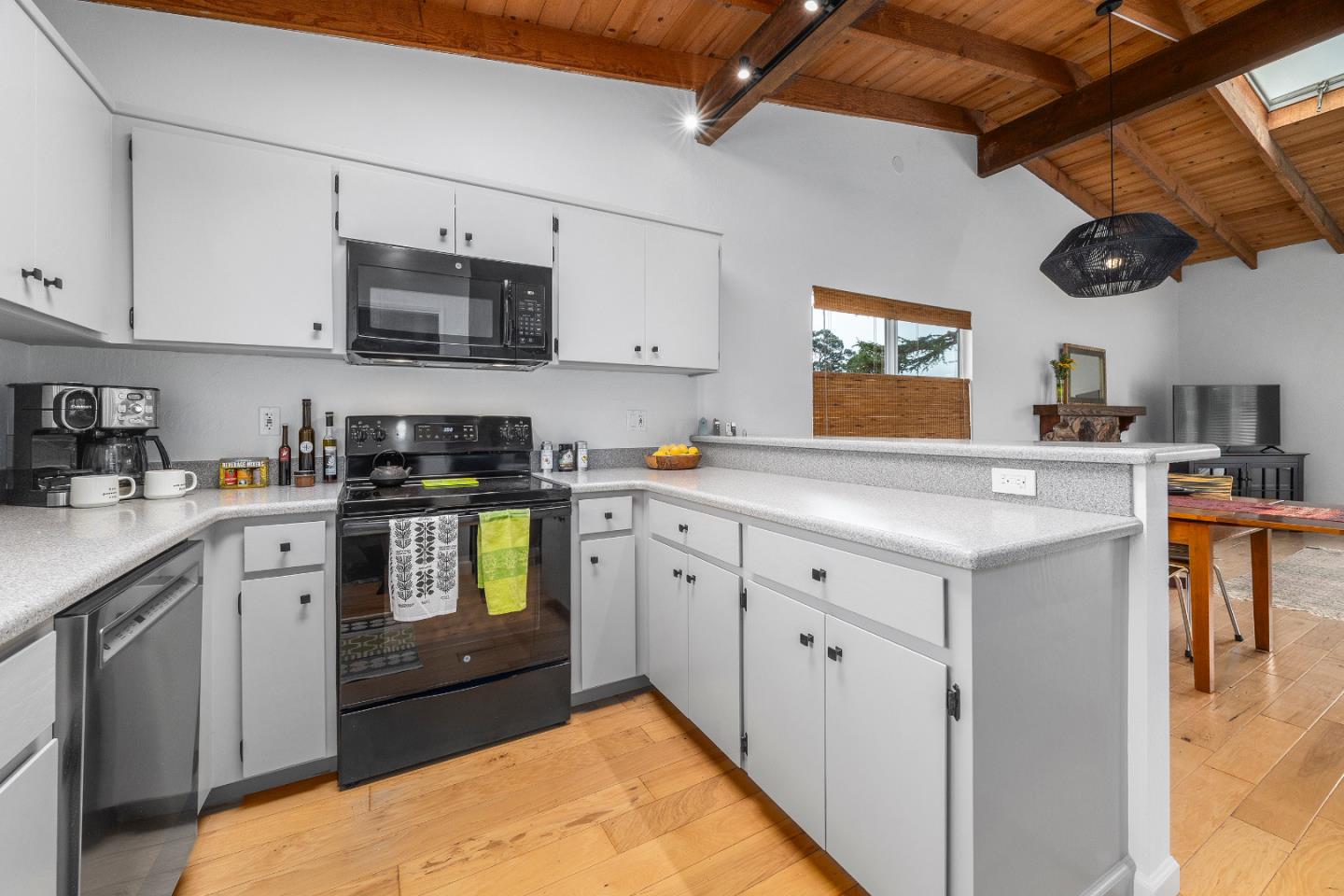 326 Doris Avenue Aptos, CA 95003 - Photo 11 of 48 a kitchen with stainless steel appliances kitchen island granite countertop a sink a stove and cabinets