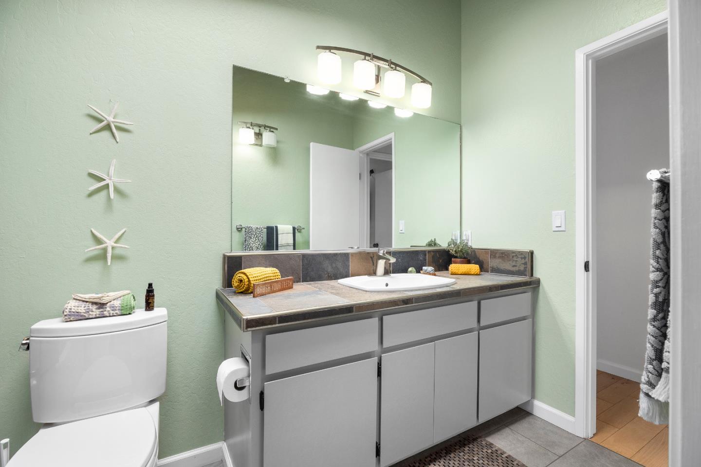 326 Doris Avenue Aptos, CA 95003 - Photo 20 of 48 a bathroom with a sink and a mirror