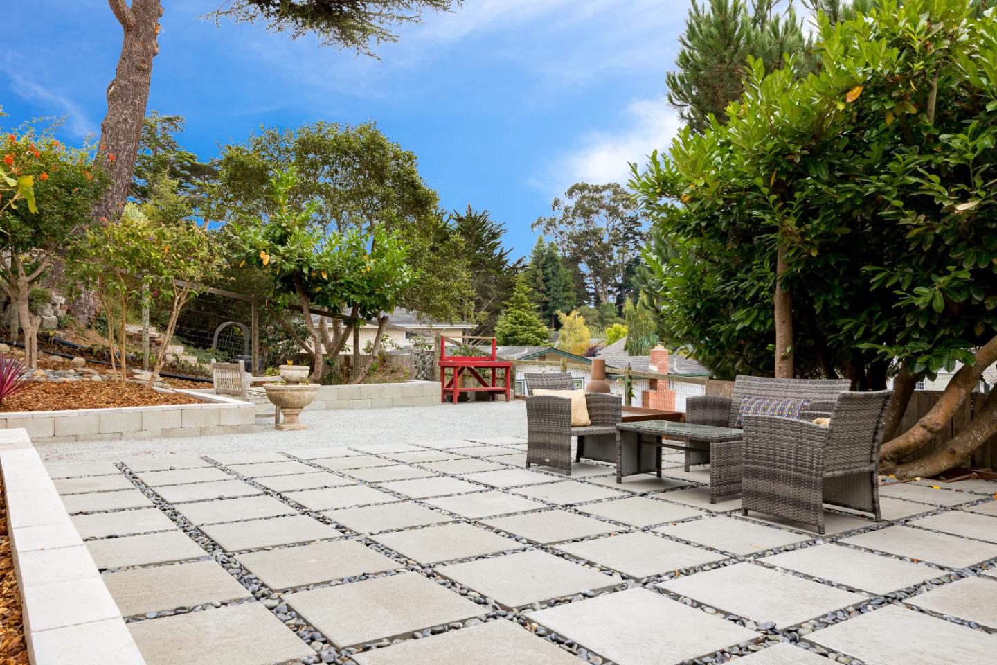 326 Doris Avenue Aptos, CA 95003 - Photo 34 of 48 a view of a patio with a dining table and chairs with wooden floor and fence