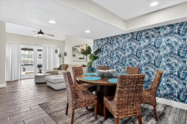 a dining room with furniture and wooden floor