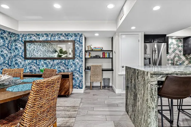a view of kitchen with furniture and flat screen tv