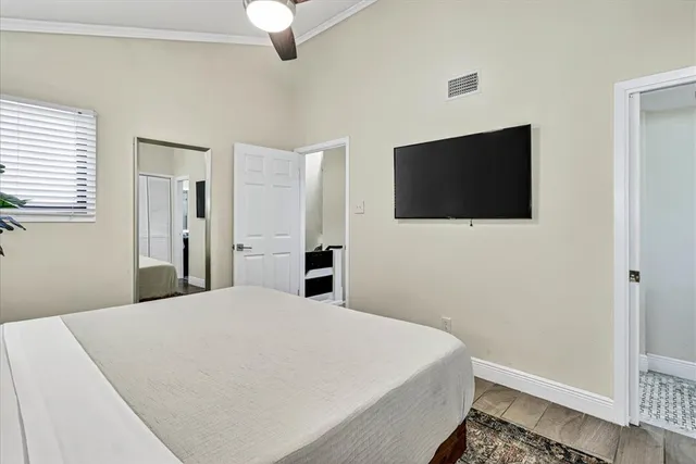 a large white bed in a white room