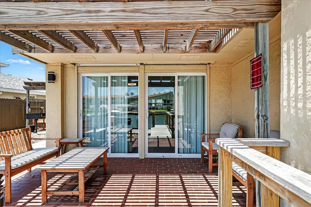 a room with furniture and large windows