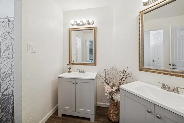 a bathroom with a sink a vanity and a mirror