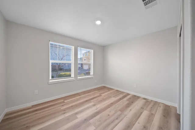 a view of room with window and hardwood floor