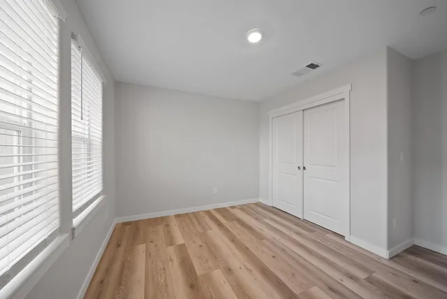 a bathroom with a sink toilet a mirror and shower