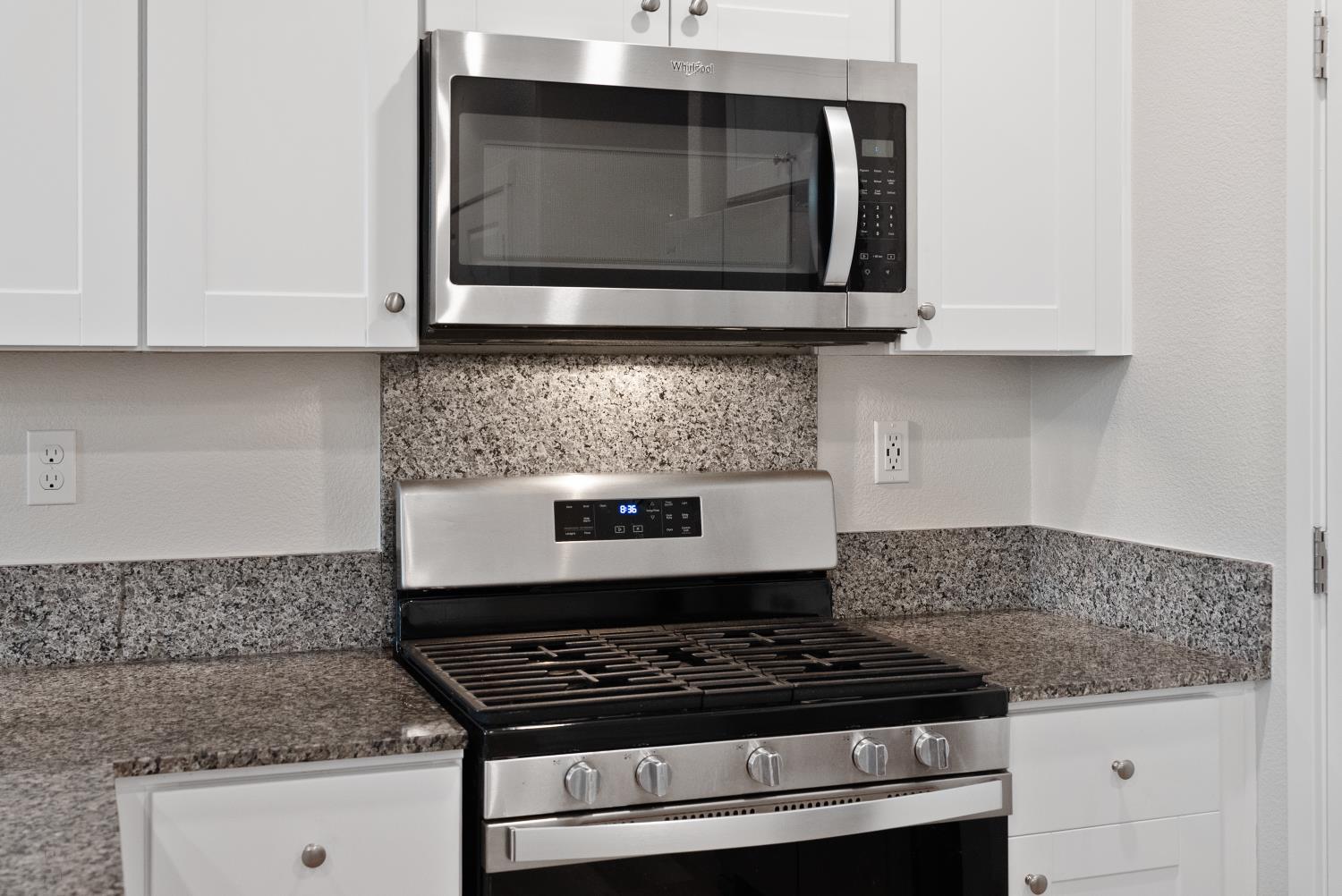 3286 New York Road West Sacramento, CA 95691 - Photo 5 of 22 a stove top oven sitting inside of a kitchen