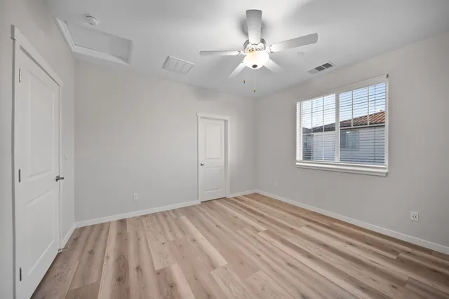 a bathroom with a shower sink vanity mirror and toilet