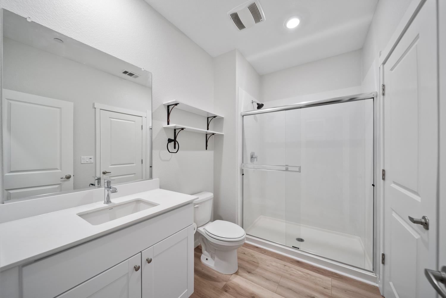 3286 New York Road West Sacramento, CA 95691 - Photo 10 of 22 a bathroom with a shower sink vanity mirror and toilet