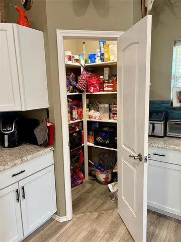 a kitchen with stainless steel appliances granite countertop a refrigerator and a stove