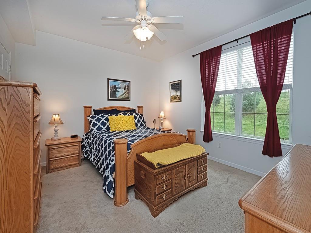 115 Shelton Place Drive Evans City, PA 16033 - Photo 15 of 24 a bedroom with a bed dresser and window