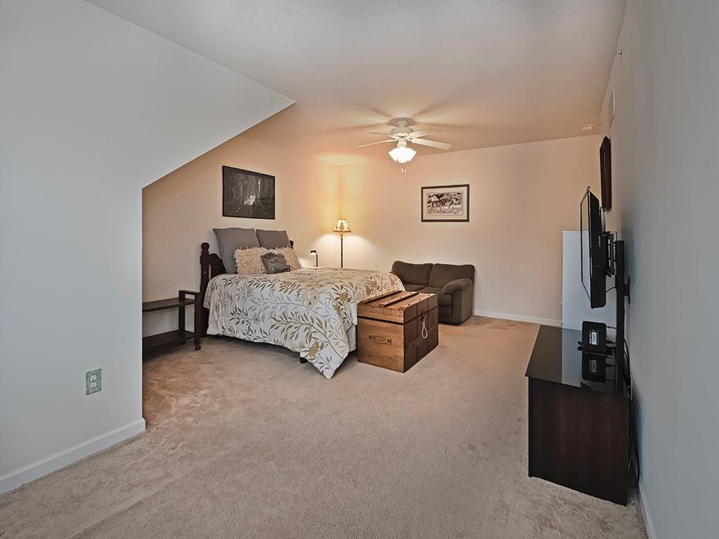 115 Shelton Place Drive Evans City, PA 16033 - Photo 22 of 24 a living room with furniture and a ceiling fan