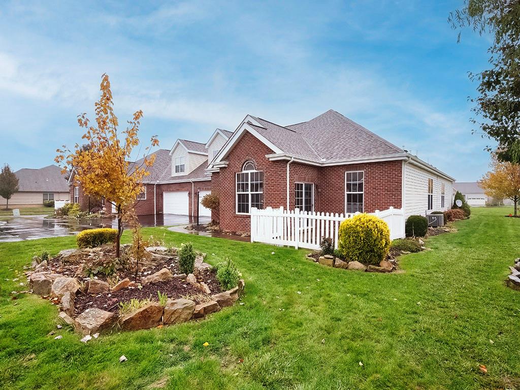 115 Shelton Place Drive Evans City, PA 16033 - Photo 24 of 24 a front view of a house with a garden and trees
