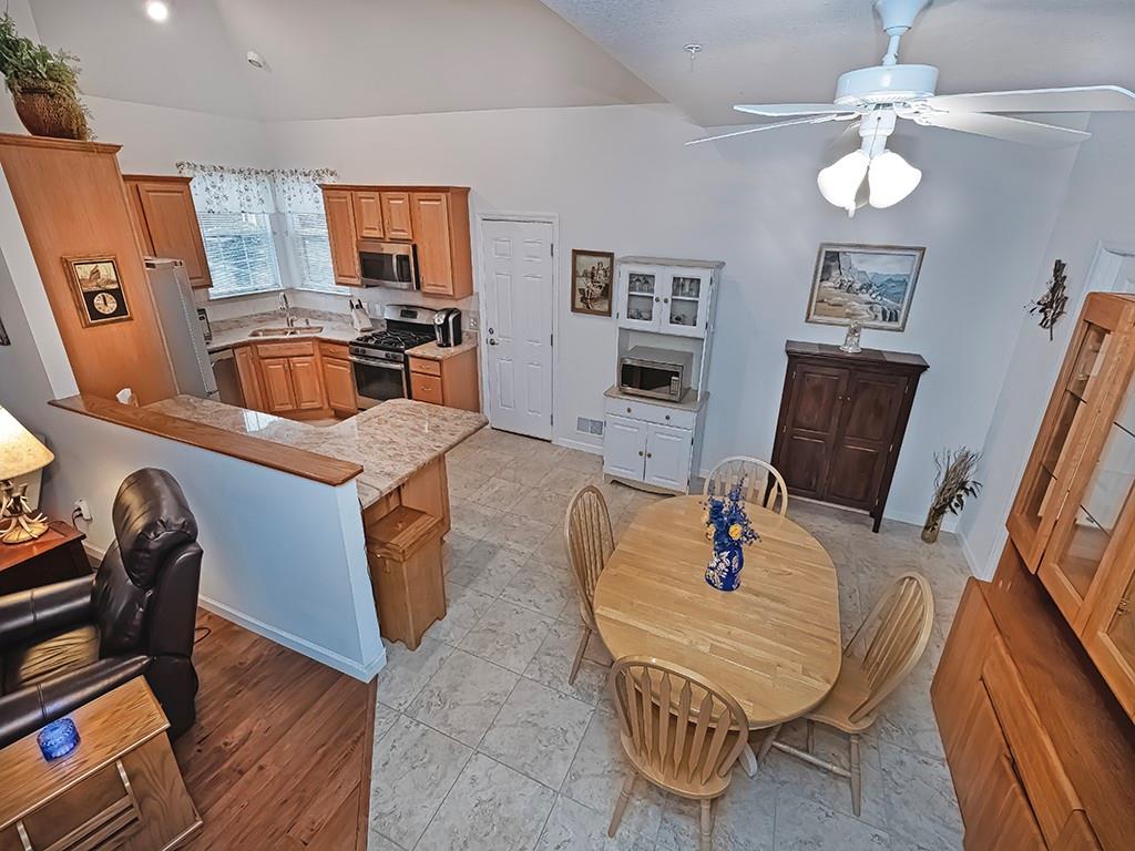 115 Shelton Place Drive Evans City, PA 16033 - Photo 10 of 24 a living room with furniture a flat screen tv and a table