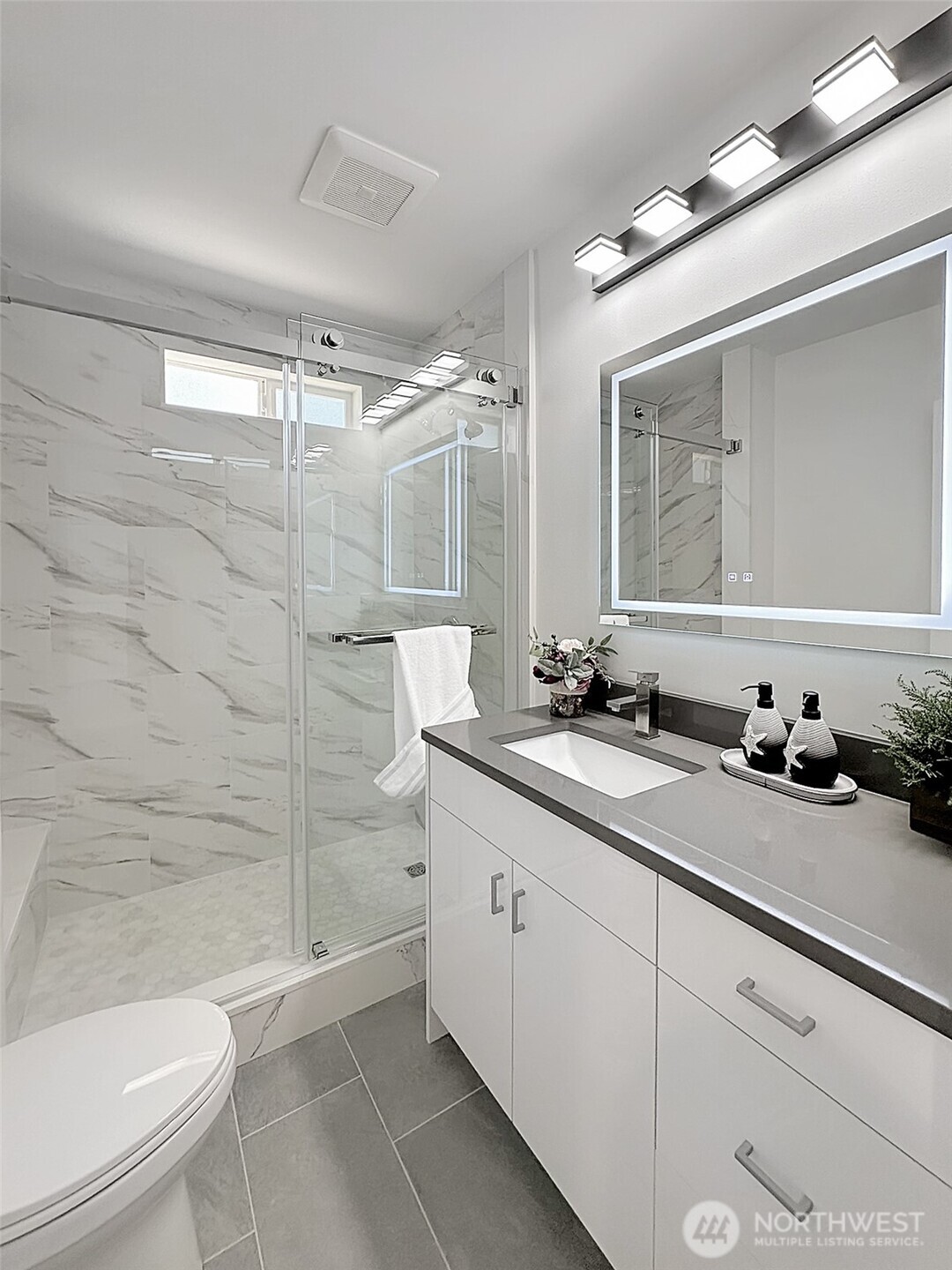 7403 Beverly Boulevard Everett, WA 98203 - Photo 8 of 19 a bathroom with a sink a toilet and shower