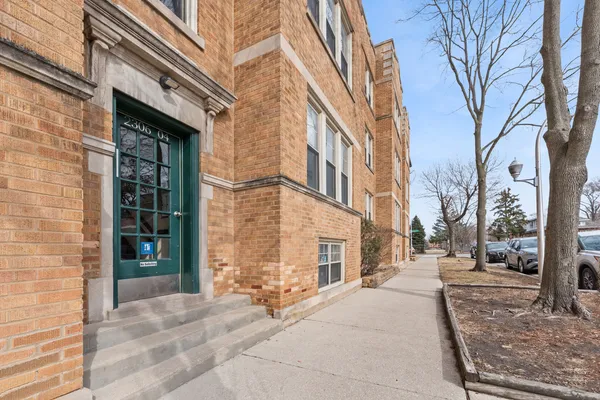 a view of a brick building next to a building