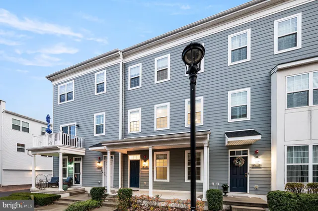 a front view of a brick building with many windows