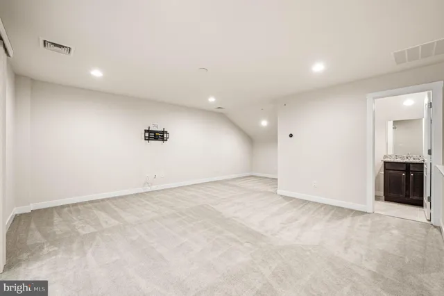 an empty room with a bathroom