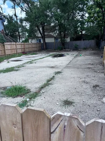 a backyard of a house with lots of green space