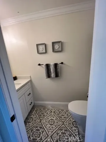 a bathroom with a toilet and a sink