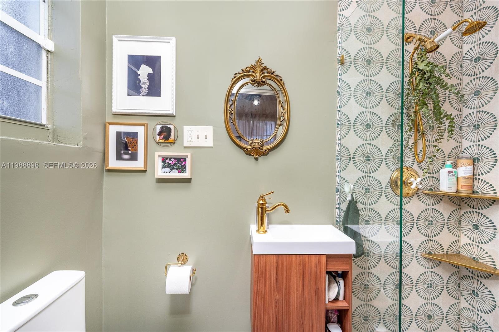 1844 Northwest 47th Street Miami, FL 33142 - Photo 19 of 24 a bathroom with a sink and a mirror