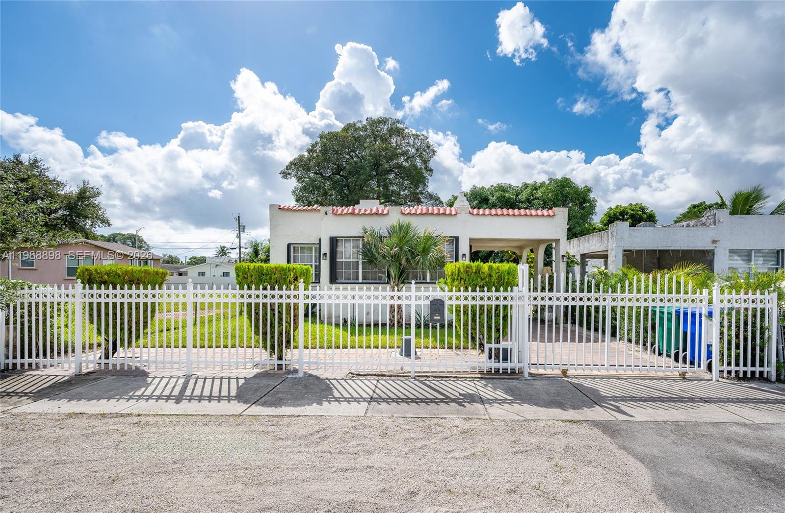 1844 Northwest 47th Street Miami, FL 33142 - Photo 3 of 24 a view of a house with a balcony